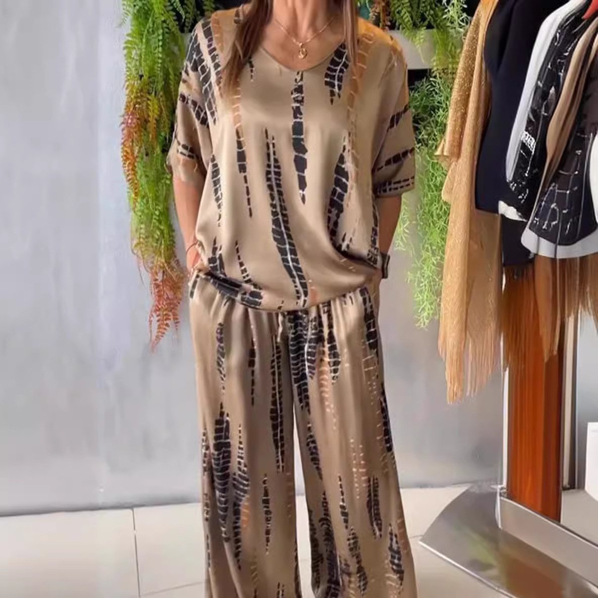 Two-piece satin casual suit with a round neckline